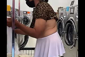 Doing laundry in mini skirt