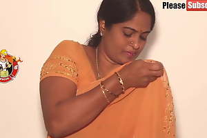 Mother enervating a yellow saree, blear
