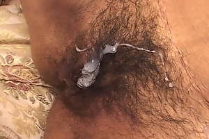 Hairy Indian pussy filled with flannel and cum