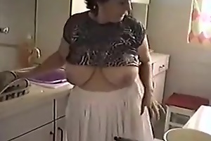 My busty of age wife strips while cleaning the kitchen